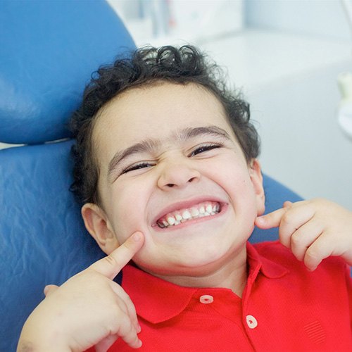 A little boy smiling at the dentist