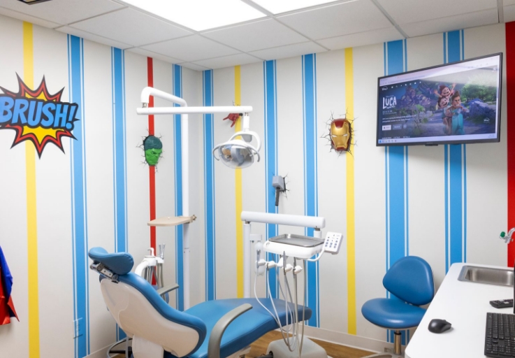 Happy Teeth sign over dental office reception desk