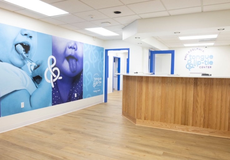 Happy Teeth sign over dental office reception desk