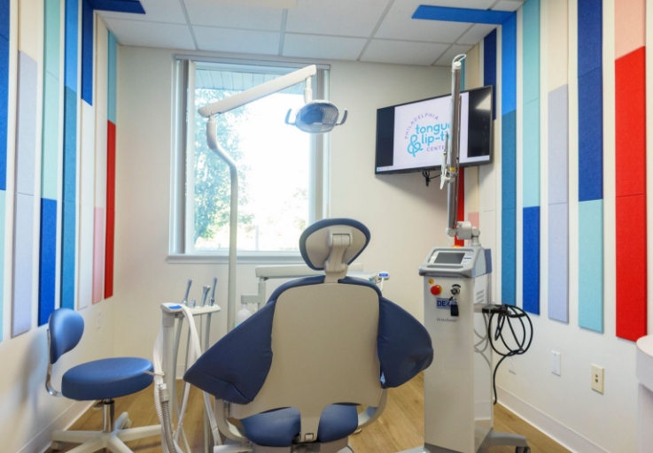 Happy Teeth sign over dental office reception desk