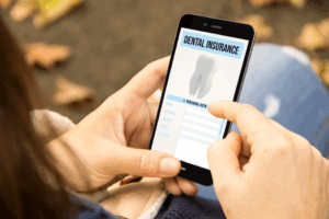 a person examining a dental insurance form