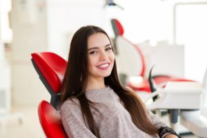 Teen girl smiling while at her pediatric dentist